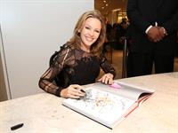 Kylie Minogue in a tight black mini dress for the launching of her book 'Kylie Fashion' at Saks Fifth Avenue