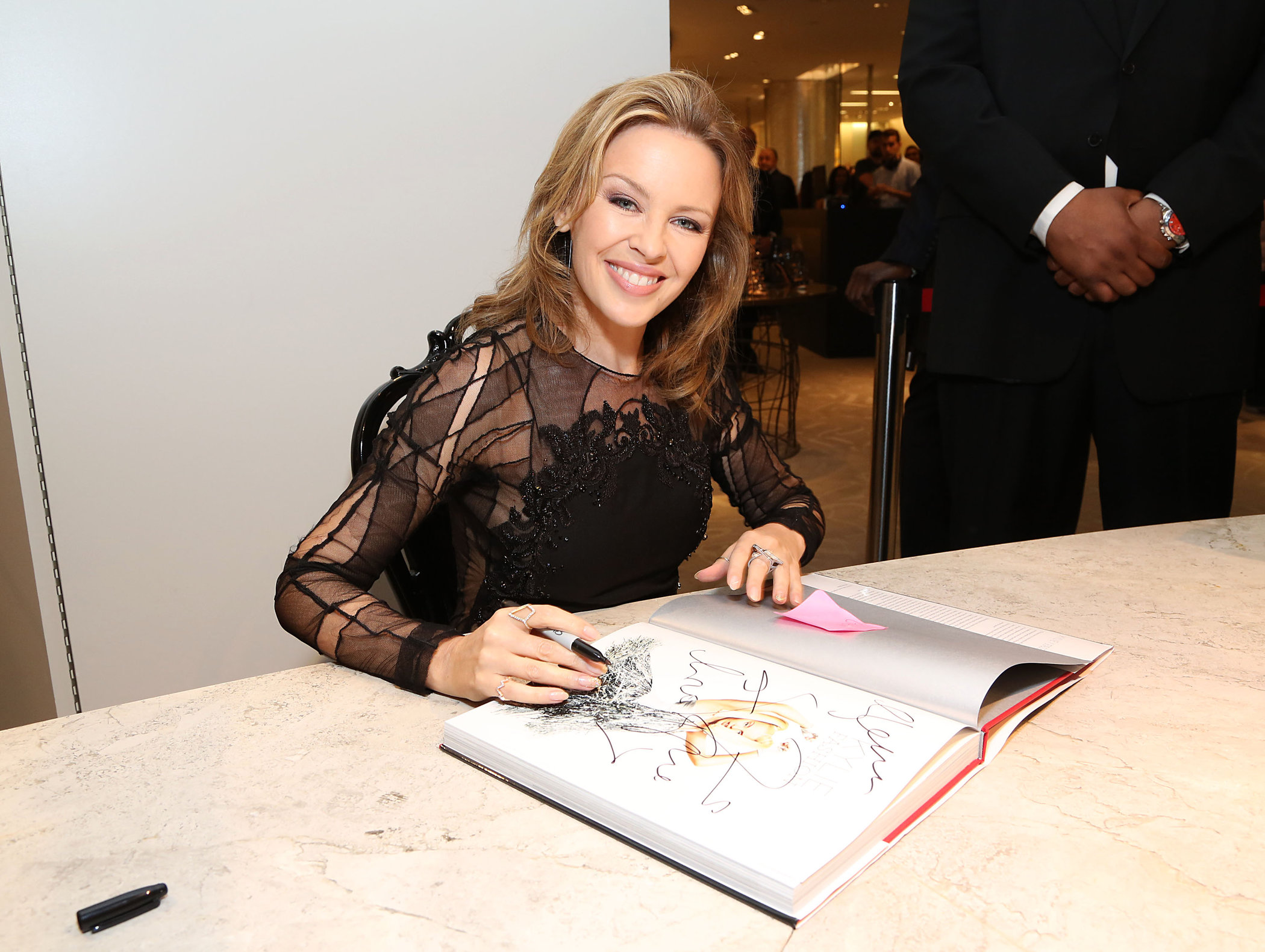 Kylie Minogue in a tight black mini dress for the launching of her book 'Kylie Fashion' at Saks Fifth Avenue