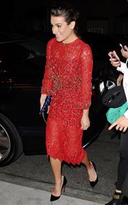 Lea Michele outside in a red dress at night