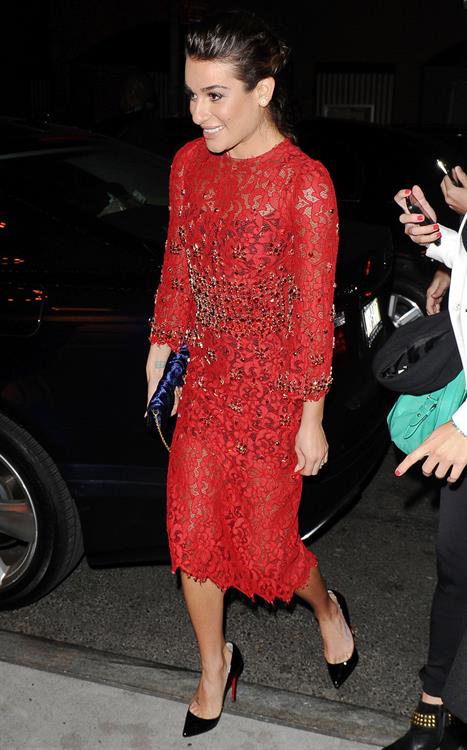 Lea Michele outside in a red dress at night