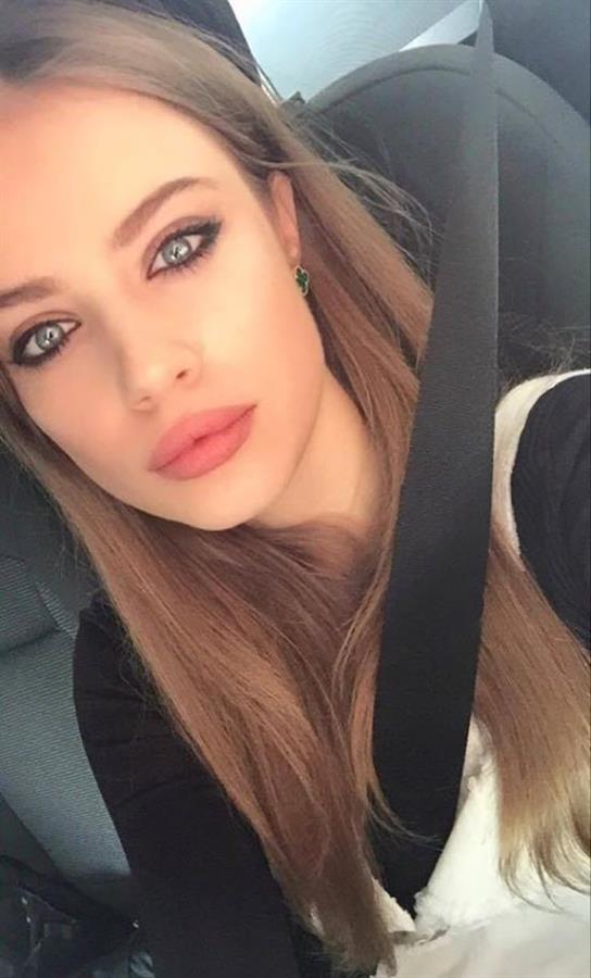 Xenia Tchoumitcheva taking a selfie