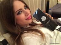 Xenia Tchoumitcheva taking a selfie