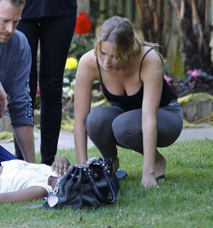 Jennifer Lawrence in Santa Monica helping a woman who fainted on June 25, 2012 