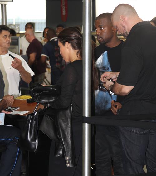 Kim Kardashian and Kanye West JFK airport in New York - 09 August 2012 