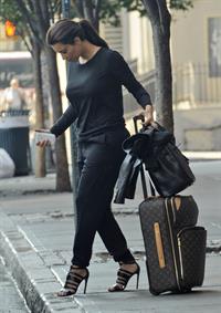 Kim Kardashian and Kanye West JFK airport in New York - 09 August 2012 