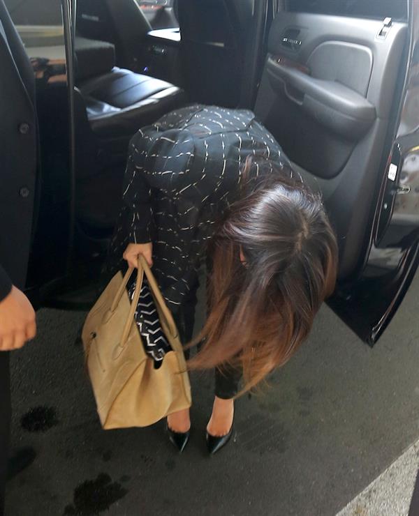Kim Kardashian catches a flight out of Miami October 4, 2012 