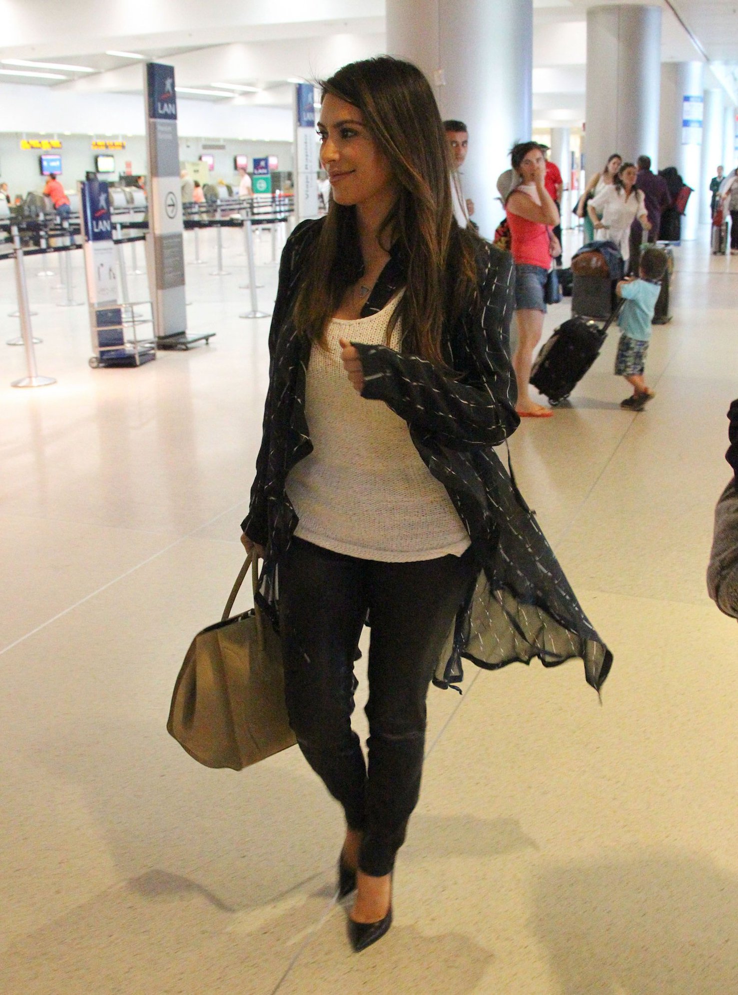 Kim Kardashian catches a flight out of Miami October 4, 2012 