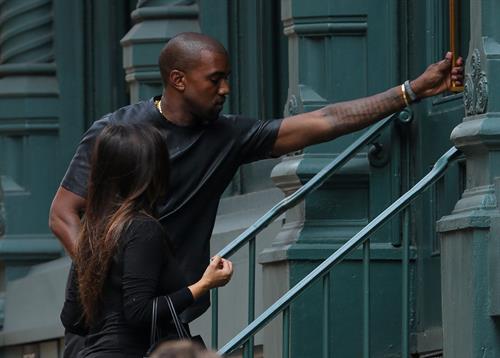 Kim Kardashian and boyfriend Kanye West walk around SoHo in New York City. They stopped at Alexander Wang to do some shopping. August 8, 2012