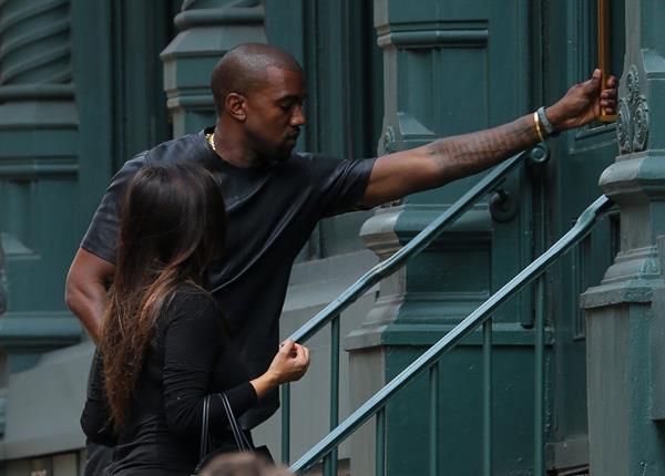 Kim Kardashian and boyfriend Kanye West walk around SoHo in New York City. They stopped at Alexander Wang to do some shopping. August 8, 2012