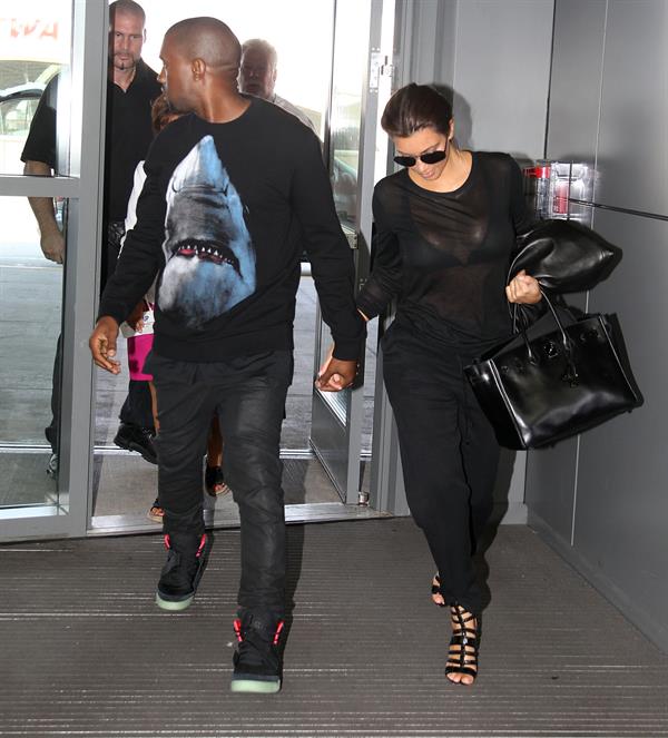 Kim Kardashian - JFK airport in New York on August 9, 2012