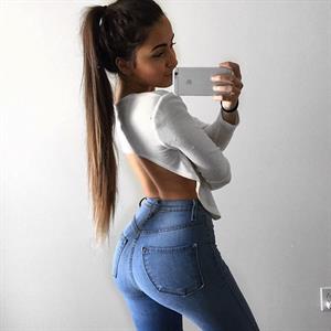 Claudia Tihan taking a selfie and - ass