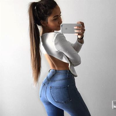 Claudia Tihan taking a selfie and - ass