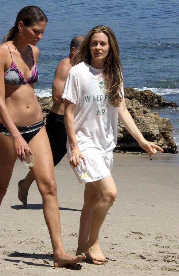 Alicia Silverstone walking on the beach in Malibu 