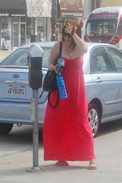 Alyson Hannigan in a red dress in Santa Monica on August 20, 2012