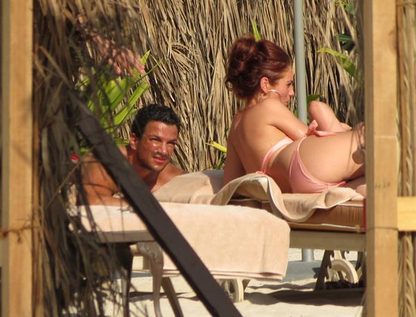 Amy Childs sunbathing with Peter Andre in Dubai on January 3, 2012