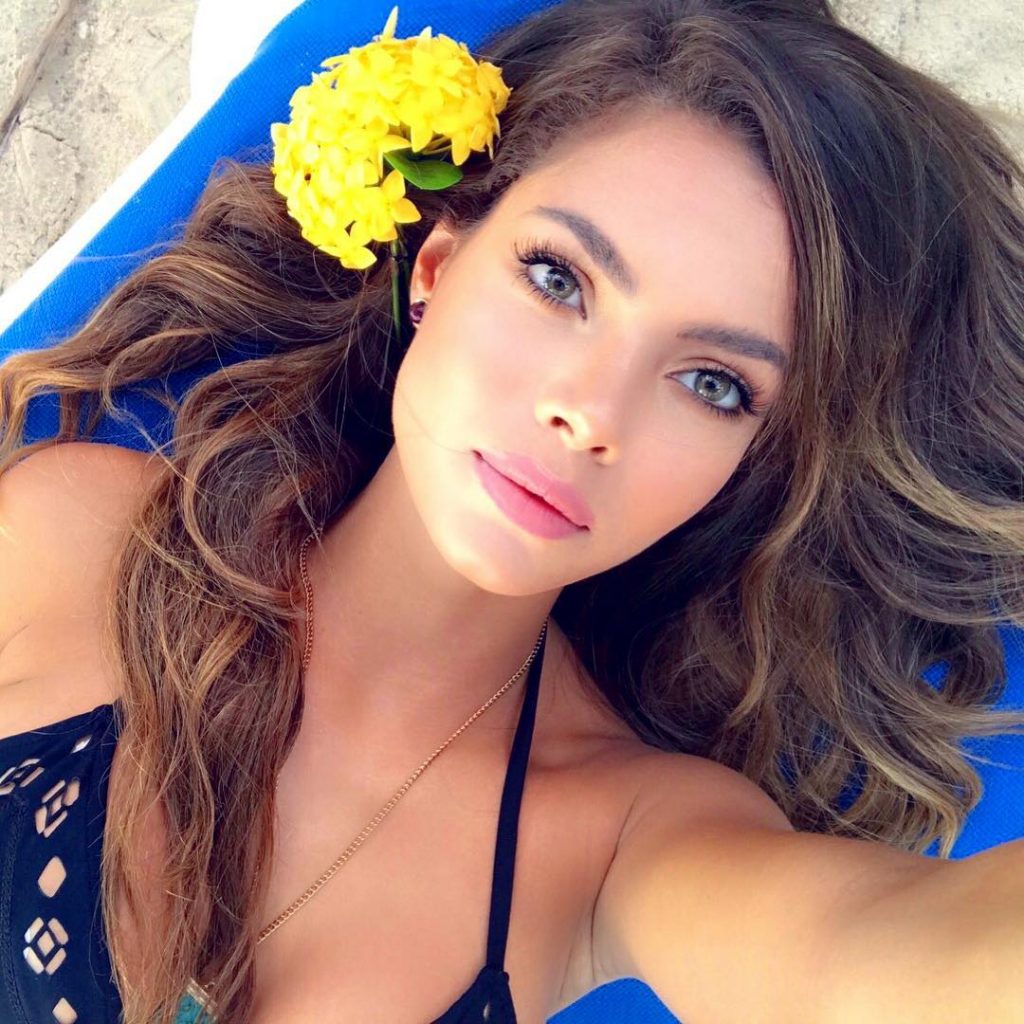 Linda Palacio in a bikini taking a selfie