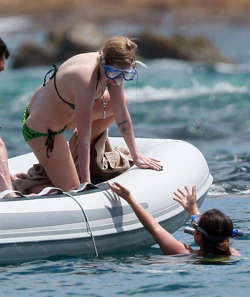 Avril Lavigne in a green bikini in Cabo, Mexico on July 27, 2012