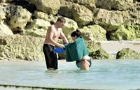 Demi Lovato and her bodyguard are spotted on the beach in Barbados April, 16 2013 
