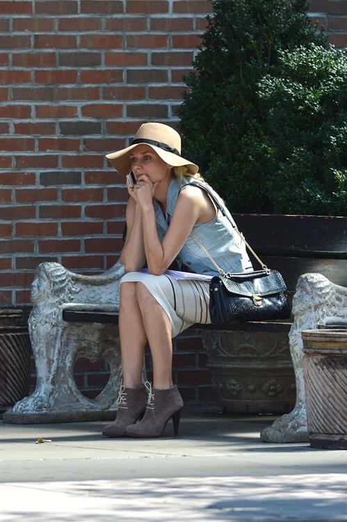 Diane Kruger - Wears a denim vest with a skirt as she chats on her cellphone while out the Bowery on September 12, 2012