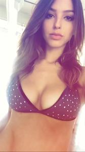 Celine Farach in lingerie taking a selfie