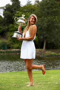 Victoria Azarenka poses with Memorial Cup after winning the 2013 Australian Open January 27, 2013 