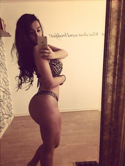 Ines Helene in a bikini taking a selfie