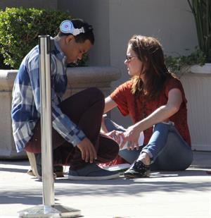 Jessica Stroup takes a break on the set of 90210 in Los Angeles on February 26, 2013