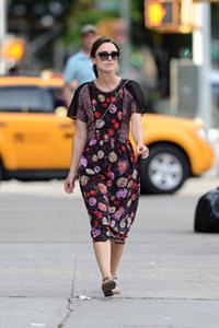 Keira Knightley wears a dark floral dress while strolling in New York City on August 7, 2012