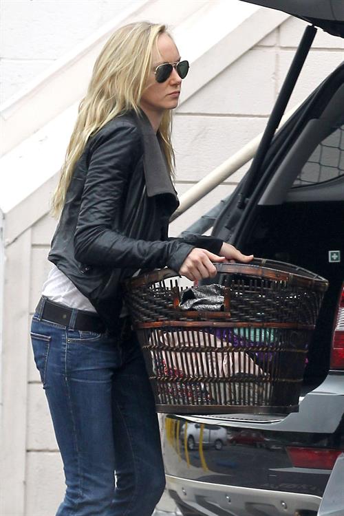 Kimberly Stewart Donating a trunk full of designer clothes at Wasteland in Los Angeles (November 15, 2012) 