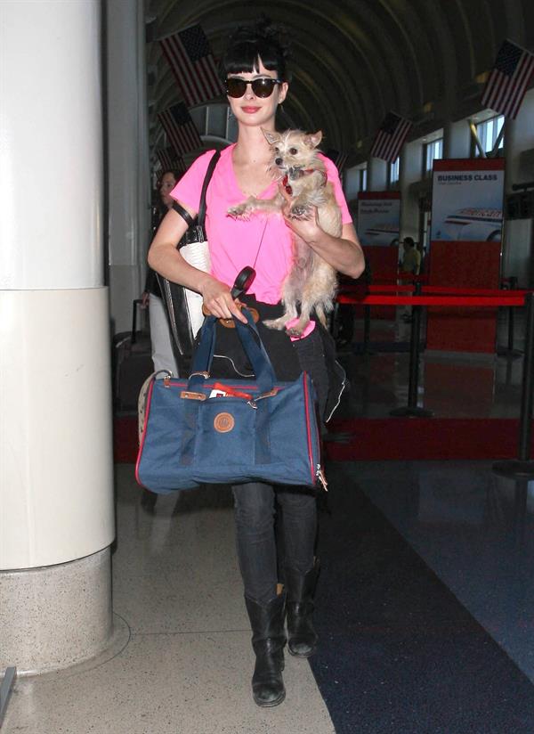 Krysten Ritter - Prepares to leave LAX in Los Angeles, California - June 8, 2012 