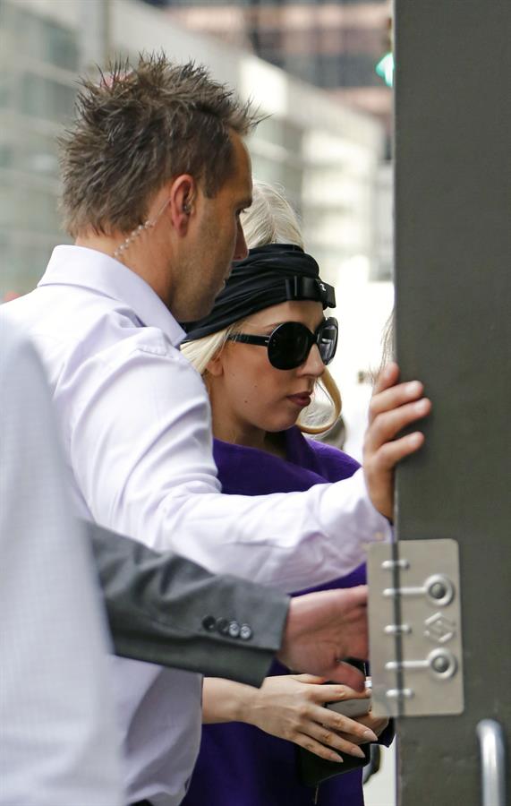 Lady Gaga holds her latest Vogue magazine cover September 2012 Issue close to her chest while out in New York City to visit a friend (07 August 2012).