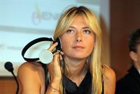 Maria Sharapova attends a press conference to present Saturday's exhibition match Milan November 30, 2012 