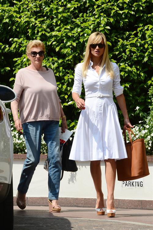 Michelle Hunziker Pictures Michelle Hunziker Leaving her house in a white dress in Milan Italy on May 9, 2013