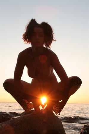 Firebird A in  Having Fun  for Erotic Beauty - Firebird A bares her gorgeous physique as she playfully poses outdoors.