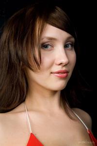 Kate in  Loving Red  for Erotic Beauty - Kate sensually strips her sexy, red bikini baring her amazing physique.