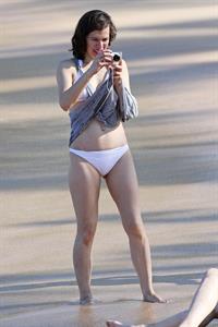 Milla Jovovich on the beach in a bikini on New Years Eve in Maui, Hawaii December 31, 2012 