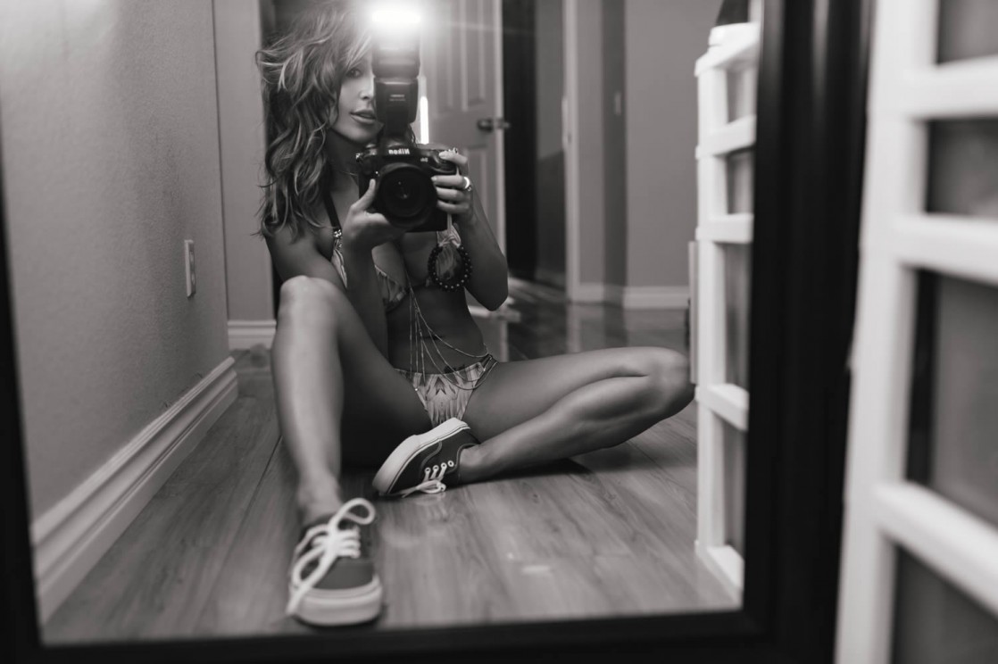 Tianna Gregory in a bikini taking a selfie