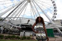 Serena Williams poses for a Photograph at the Wheel of Brisbane in South Bank December 31, 2012 