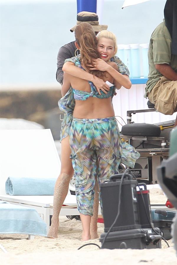 Minka Kelly and Rachael Taylor hug while filming Charlie's Angels on a beach in Miami 02-09-11