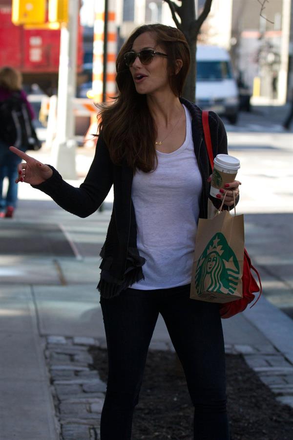 Minka Kelly outside her hotel with her morning Starbucks in New York City 8/2/2012 