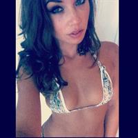 Nicole Mejia in a bikini taking a selfie