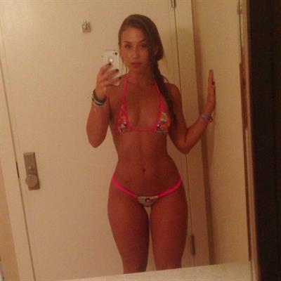 Nicole Mejia in a bikini taking a selfie