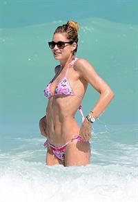 Doutzen Kroes enjoys a day on the beach in Miami Beach, FL on April 28, 2013