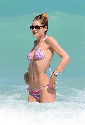 Doutzen Kroes enjoys a day on the beach in Miami Beach, FL on April 28, 2013