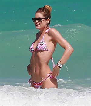 Doutzen Kroes enjoys a day on the beach in Miami Beach, FL on April 28, 2013
