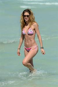 Doutzen Kroes enjoys a day on the beach in Miami Beach, FL on April 28, 2013