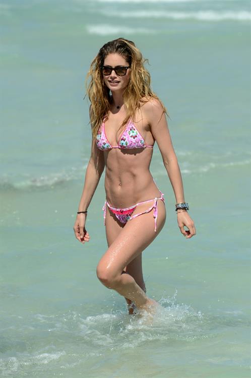 Doutzen Kroes enjoys a day on the beach in Miami Beach, FL on April 28, 2013