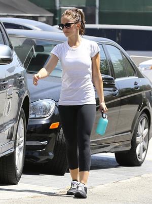Minka Kelly leaving the gym in West Hollywood wearing a white shirt and black pants