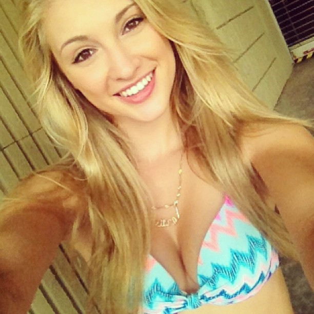 Anna Faith Carlson in a bikini taking a selfie