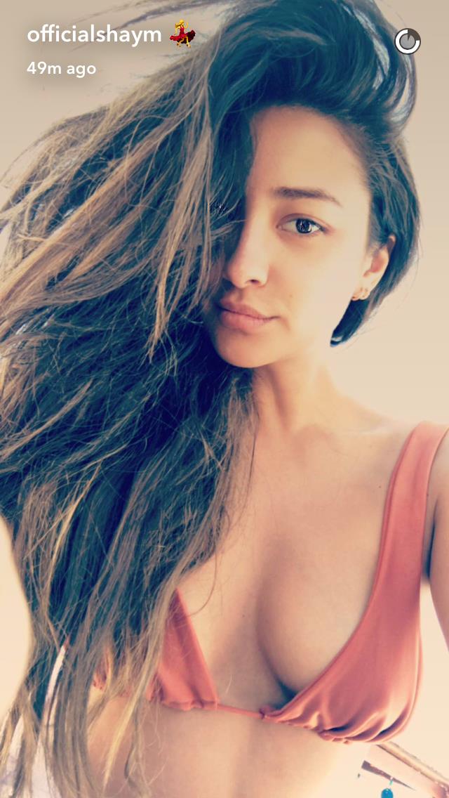 Shay Mitchell in a bikini taking a selfie